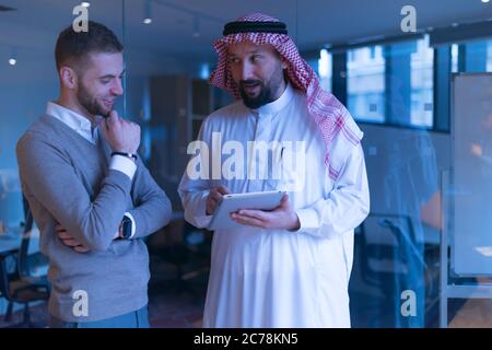 Arab Businessman talking with American Businessman.  Confirmation of Business alliance Partners as WELL. Adhering Respect, Commitment and Integrity in Stock Photo