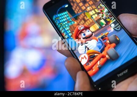 Smart phone with the MARIO KART TOUR logo, is a popular game for phones.  United States, Canada, December 4, 2019 Stock Photo - Alamy
