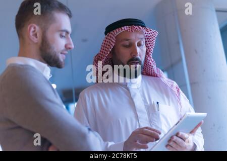 Arab Businessman talking with American Businessman.  Confirmation of Business alliance Partners as WELL. Adhering Respect, Commitment and Integrity in Stock Photo