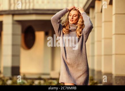 Warm oversized sweater. Free style comfortable. Woman wear sweater.  Elongated sweatshirt tunic dress. Enjoy softness. Blonde girl make up face  fall outfit. Knitwear concept. Cashmere woolen sweater Stock Photo - Alamy