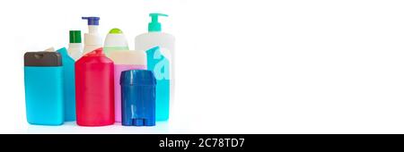 Collection of colorful plastic bottles and containers of hygiene products on panoramic white background Stock Photo
