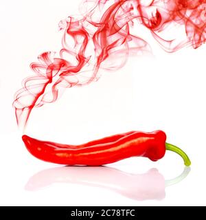 Red hot chili pepper isolated on white background with red smoke Stock Photo