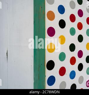 Colorful polka dots on wall, Placencia Peninsula, Belize Stock Photo