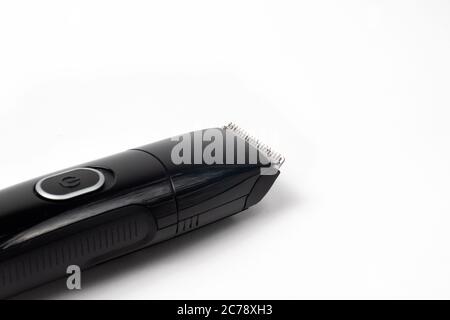 Electric black razor trimmer for shaving beards and hair shearing on a white background isolate. Stock Photo