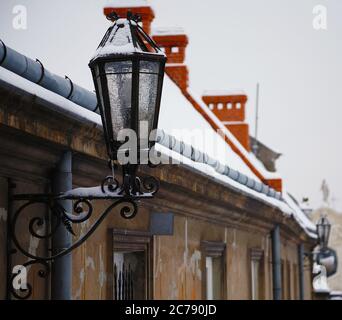 Antique street latern. Old-fashion street lighting on the wall Stock Photo