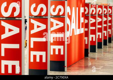 Light boards with sale signs on in a store. Concept of shopping, sales, discounts Stock Photo
