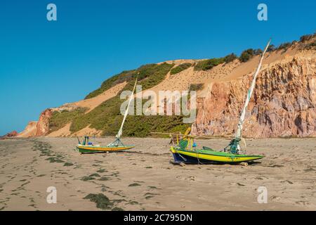 Fishing boats in the sand at Ponta Grossa beach, Icapui, Ceara, Brazil Stock Photo