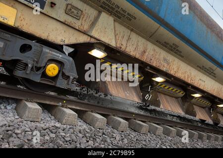 Network Rail train laying new ballast on track on a stretch of railway in England, UK. Stock Photo