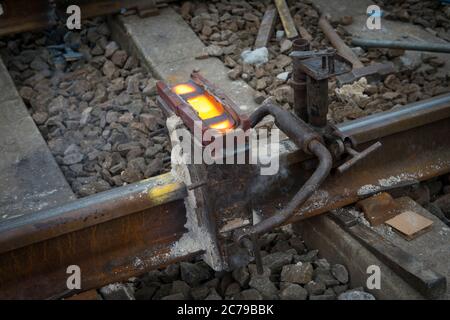 Thermit welding on rail track in the UK. Stock Photo