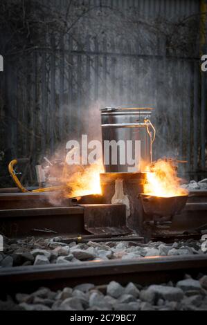 Thermit welding on rail track in the UK. Stock Photo