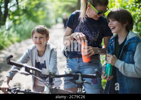 Mother and sons enjoying bike ride Stock Photo