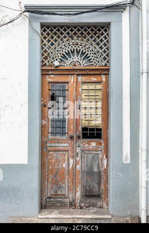 Colorful wooden door in the facade of a typical Portuguese house at Porto, Portugal. Stock Photo