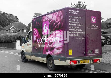 Ocado van, Ocado delivery van, stopped in street to deliver home groceries at Poole, Dorset UK in July - Ocado lorry, Ocado truck in road Stock Photo