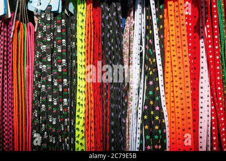 Colourful shoelaces on display at Camden market in London Stock Photo