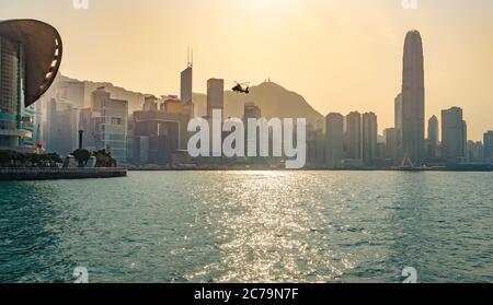 Hong Kong, Victoria Harbour, Skyline with Helicopter Stock Photo