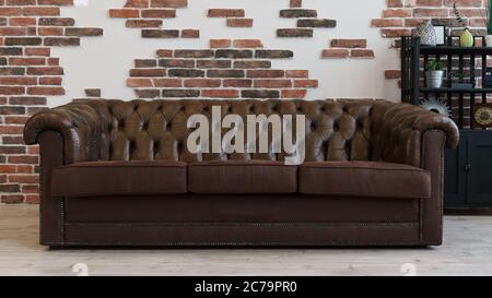 Brown leather couch in Loft style room Stock Photo