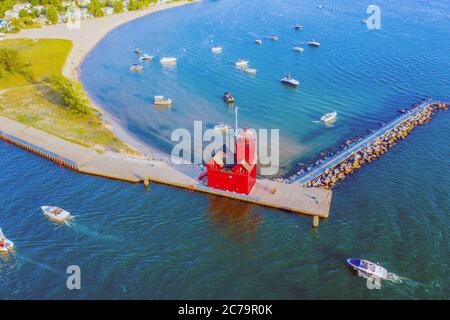 Aerial view of the Holland Harbor Lighthouse, Big Red Lighthouse, at the channel connecting Lake Macatawa with Lake Michigan; Holland State Park Stock Photo