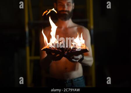 Man hold burning book in his hands Stock Photo