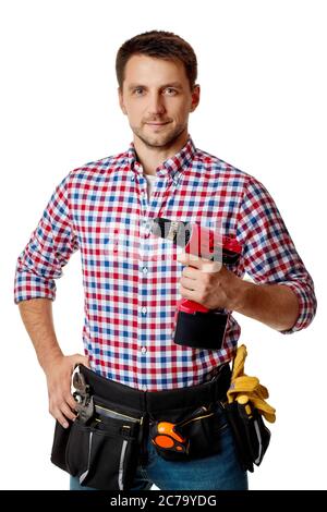 caucasian repairman worker holding cordless screwdriver. handyman wearing tool belt isolated on white studio background Stock Photo