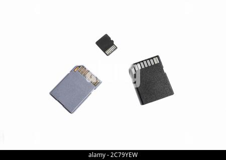 three SD memory cards on a white background, selective focus Stock Photo