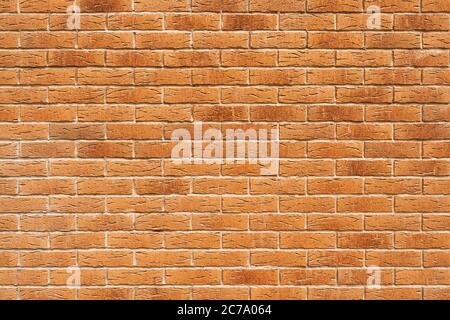 Blank decorative grungy stonewall. Panoramic background of wide old red brick wall texture Stock Photo