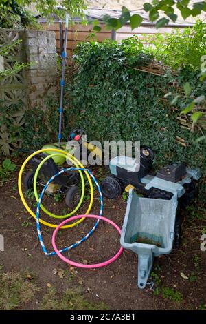 Discarded toys in garden Stock Photo