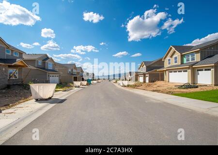 A street of new homes being built in a residential subdivision in Spokane, Washington, USA Stock Photo