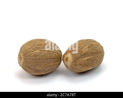 Nutmegs isolated against a white background Stock Photo