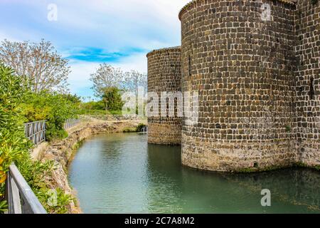 The Etruscan natural and archaeological park of Vulci, in the province of Viterbo, Lazio, Italy. Abbadia Castle and the 'Devil's Bridge' Stock Photo