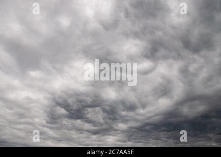 Dramatic gray clouds in the rainy sky Stock Photo