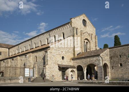 The panoramic view of the facade of the Basilica of Aquileia, Italy, dedicated to the Virgin and Saints Ermacora and Fortunato, originates in the Roma Stock Photo