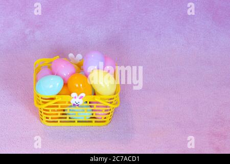 Festive Easter decorations and pink background. Stock Photo