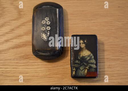 Ornate boxes produced in pocket size and larger communal for table use to keep snuff dry. They hold few days tobacco supply for immediate consumption. Stock Photo