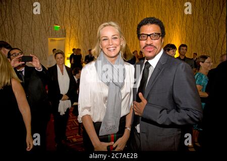 Sharon Stone greeting Lionel Richie at  party for Mexico The Royal Tour screening in Los Angeles 9/21/11 Stock Photo