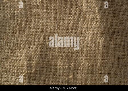 Fabric texture close up, rough brown canvas background, macro shot. Stock Photo