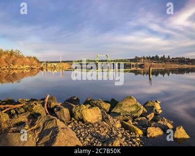 Bullards Bridge in Bandon, Oregon. Rocks in foreground.  Stock Photo