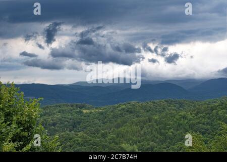 Stormy clouds over the hills Stock Photo