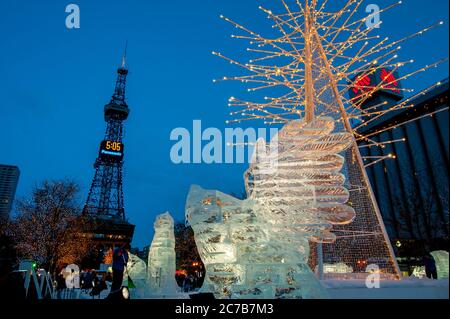 Ice sculptures illuminated at night at the Sapporo Snow Festival in Sapporo, Hokkaido Island, Japan. Stock Photo