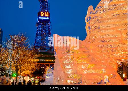 Ice sculptures illuminated at night at the Sapporo Snow Festival in Sapporo, Hokkaido Island, Japan. Stock Photo