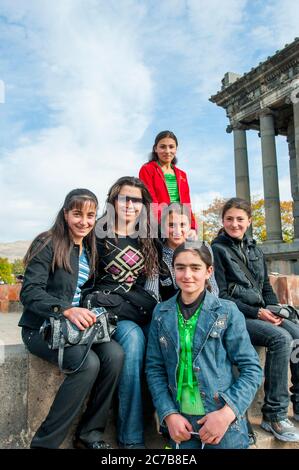 Teenage Armenian girls during a visit to the Temple of Garni, which is the only standing Greco-Roman colonnaded building near Yerevan, Armenia. Stock Photo