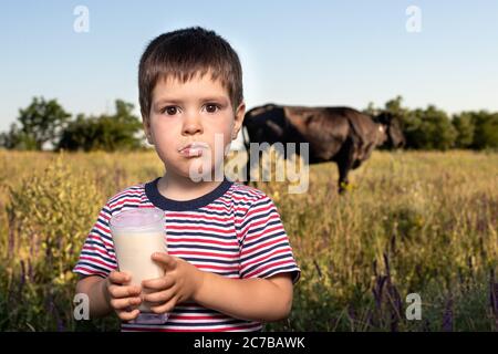 A small child boy in a striped bright T 