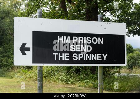 Sign at the entrance to HM Prison Send in Surrey, UK, a women's prison Stock Photo