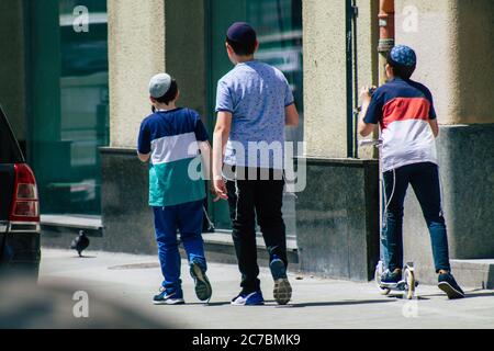 Budapest Hungary july 15, 2020 View of unidentified Jewish kids walking front the Great Synagogue of Budapest Stock Photo