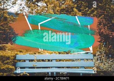 Beautiful shot of a white bench near yellow leafed trees with a cool effect Stock Photo