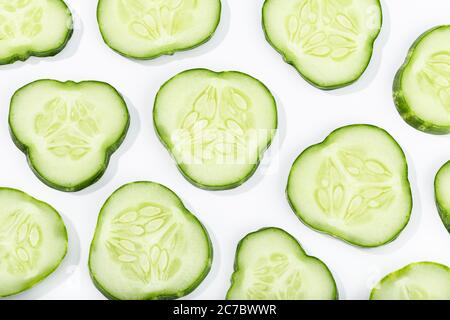 Cucumber slices pattern isolated on white background. Cucumis sativus background Stock Photo
