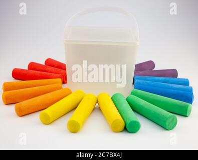 Set of colorful chalks in plastic box isolated on white background. Close-up, layout. Place for text and labels. Set children's large chalk for Stock Photo