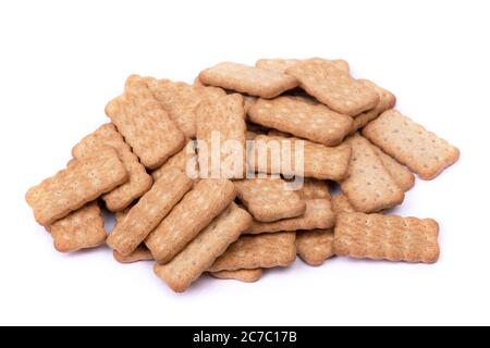 Heap of simple small cookies isolated over white background Stock Photo