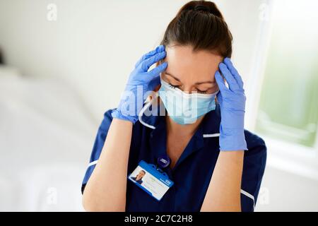 Stressed Nurse at work Stock Photo