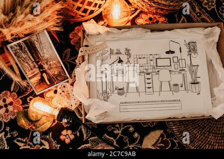 Closeup shot of a box with an interior illustration inside, a photo of a couple next to the box Stock Photo