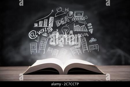The blackboard paint and opened the book on the table Stock Photo